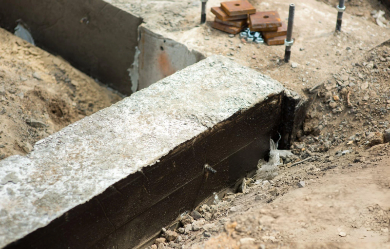 Exposed concrete slab edge during foundation repair
